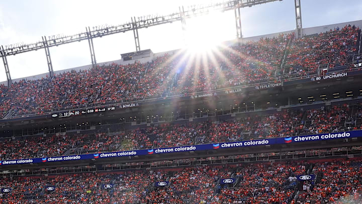 Sep 7, 2025; Denver, Colorado, USA; Denver Broncos wide receiver Marvin Mims Jr. (19) attempts to catch a pass against Tennessee Titans cornerback Marcus Harris (26) in the second half at Empower Field at Mile High. 