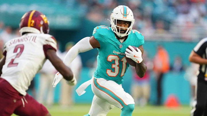Aug 17, 2024; Miami Gardens, Florida, USA; Miami Dolphins running back Raheem Mostert (31) gets short gain as Washington Commanders cornerback Mike Sainristil (2) closes in during the first quarter at Hard Rock Stadium. Mandatory Credit: Jim Rassol-Imagn Images Aug 17, 2024; Miami Gardens, Florida, USA; Miami Dolphins running back Raheem Mostert (31) gets short gain as Washington Commanders cornerback Mike Sainristil (2) closes in during the first quarter at Hard Rock Stadium. Mandatory Credit: Jim Rassol-Imagn Images