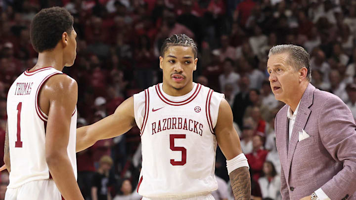 Arkansas Razorbacks guards Meleek Thomas (1) and Darius Acuff Jr (5) talk to coach John Calipari during the second half against the Tennessee Volunteers at Bud Walton Arena in Fayetteville, Ark.