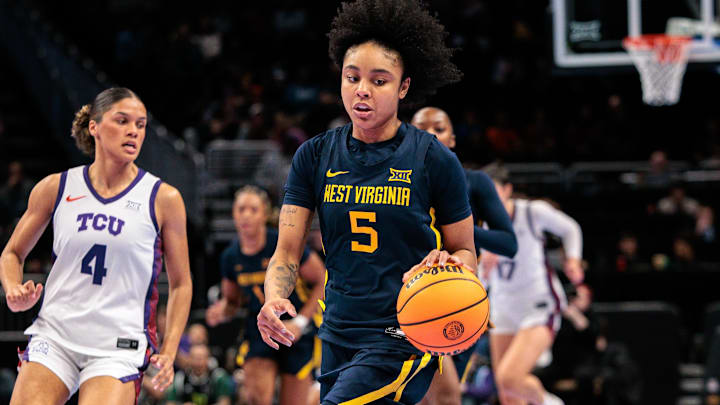 Mar 8, 2026; Kansas City, MO, USA; West Virginia Mountaineers guard Sydney Shaw (5) brings the ball up court during the first half against the TCU Horned Frogs at T-Mobile Center. Mandatory Credit: William Purnell-Imagn Images