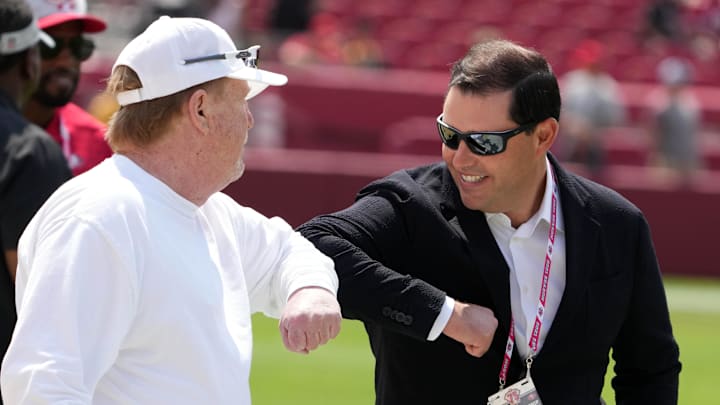 Las Vegas Raiders owner Mark Davis (left) bumps elbows with San Francisco 49ers chief executive officer Jed York (right) Las Vegas Raiders owner Mark Davis (left) bumps elbows with San Francisco 49ers chief executive officer Jed York (right)