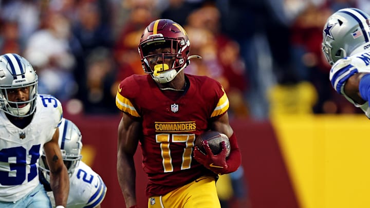 Nov 24, 2024; Landover, Maryland, USA; Washington Commanders wide receiver Terry McLaurin (17) runs for a touchdown against Dallas Cowboys cornerback Josh Butler (31) during the fourth quarter at Northwest Stadium. Mandatory Credit: Peter Casey-Imagn Images Nov 24, 2024; Landover, Maryland, USA; Washington Commanders wide receiver Terry McLaurin (17) runs for a touchdown against Dallas Cowboys cornerback Josh Butler (31) during the fourth quarter at Northwest Stadium. Mandatory Credit: Peter Casey-Imagn Images
