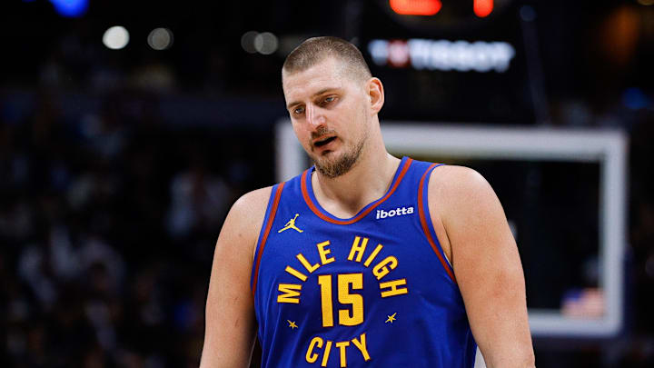 Dec 1, 2025; Denver, Colorado, USA; Denver Nuggets center Nikola Jokic (15) reacts in the fourth quarter against the Dallas Mavericks at Ball Arena. Dec 1, 2025; Denver, Colorado, USA; Denver Nuggets center Nikola Jokic (15) reacts in the fourth quarter against the Dallas Mavericks at Ball Arena.