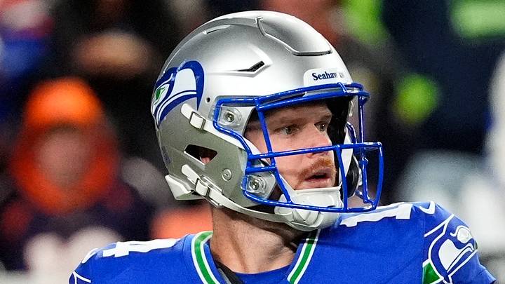 Seattle Seahawks quarterback Sam Darnold looks to throw 