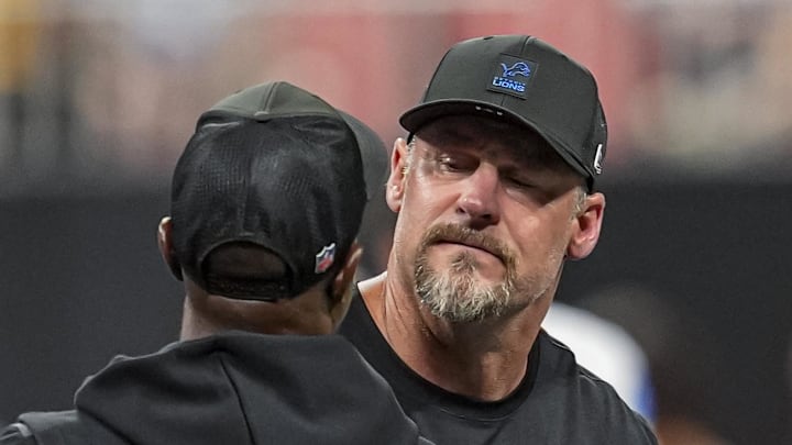 Detroit Lions head coach Dan Campbell greets Atlanta Falcons coach Raheem Morris