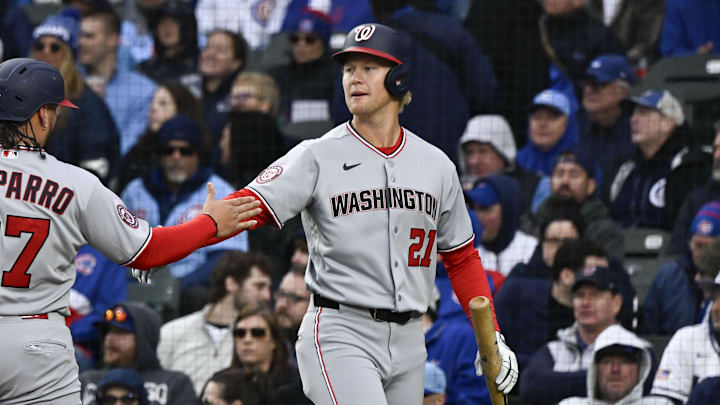 Mar 26, 2026; Chicago, Illinois, USA;  Washington Nationals first baseman Andrés Chaparro (87) high fives  left fielder Joey Wiemer (21) after scoring against the Chicago Cubs during the fourth inning at Wrigley Field. Mandatory Credit: Matt Marton-Imagn Images