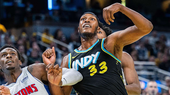 Nov 24, 2023; Indianapolis, Indiana, USA; Detroit Pistons center Jalen Duren (0) and Indiana Pacers center Myles Turner (33) fight for a rebound in the second half at Gainbridge Fieldhouse. Mandatory Credit: Trevor Ruszkowski-Imagn Images
