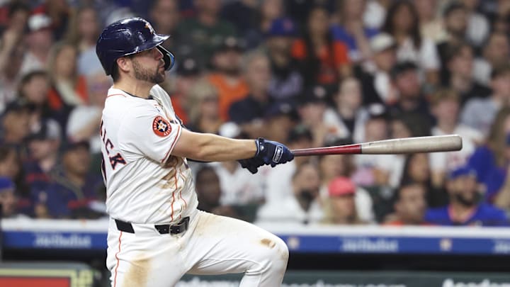 Mar 29, 2025; Houston, Texas, USA; Houston Astros center fielder Chas McCormick (20) hits a single during the eighth inning against the New York Mets at Daikin Park. 