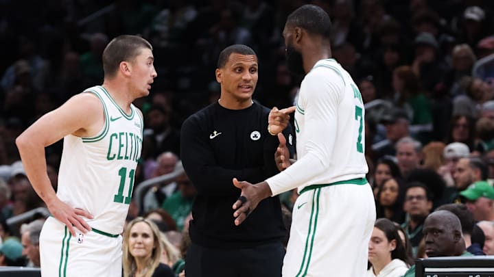 Oct 15, 2025; Boston, Massachusetts, USA; Boston Celtics head coach Joe Mazzulla talks with Boston Celtics guard Payton Pritchard (11) and Boston Celtics forward Jaylen Brown (7) during the first half against the Toronto Raptors at TD Garden. Mandatory Credit: Paul Rutherford-Imagn Images