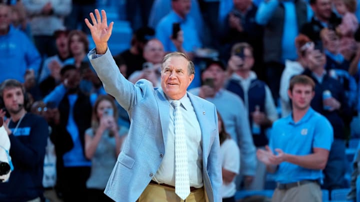 Dec 14, 2024; Chapel Hill, North Carolina, USA; North Carolina Tar Heels head football coach Bill Belichick is introduced during half time at Dean E. Smith Center. Mandatory Credit: Bob Donnan-Imagn Images Dec 14, 2024; Chapel Hill, North Carolina, USA; North Carolina Tar Heels head football coach Bill Belichick is introduced during half time at Dean E. Smith Center. Mandatory Credit: Bob Donnan-Imagn Images