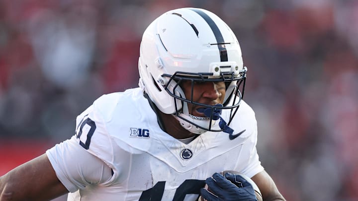 Nov 29, 2025; Piscataway, New Jersey, USA; Penn State Nittany Lions running back Nicholas Singleton (10) carries the ball against the Rutgers Scarlet Knights during the first half at SHI Stadium. Mandatory Credit: Vincent Carchietta-Imagn Images Nov 29, 2025; Piscataway, New Jersey, USA; Penn State Nittany Lions running back Nicholas Singleton (10) carries the ball against the Rutgers Scarlet Knights during the first half at SHI Stadium. Mandatory Credit: Vincent Carchietta-Imagn Images