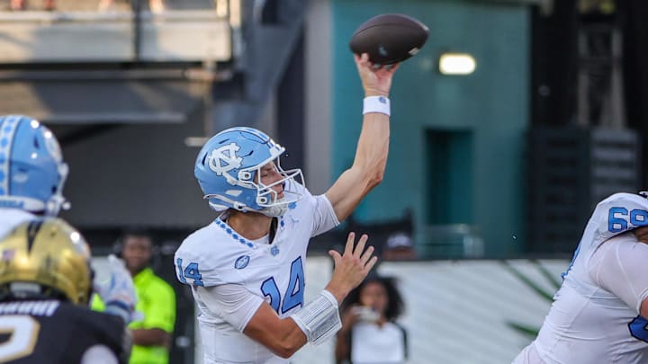 Sep 20, 2025; Orlando, Florida, USA; North Carolina Tar Heels quarterback Max Johnson (14) throws a pass during the second half against the UCF Knights at the Bounce House Stadium. Mandatory Credit: Mike Watters-Imagn Images