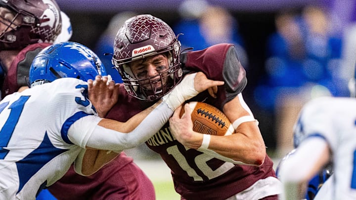 Grundy Center's Judd Jirovsky (12) runs the ball up the middle on Thursday, Nov. 21, 2024, at the UNI-Dome in Cedar Falls, IA.