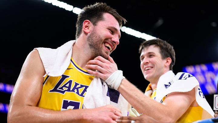 Los Angeles Lakers guard Luka Doncic (77) reacts with guard Austin Reaves (15) 