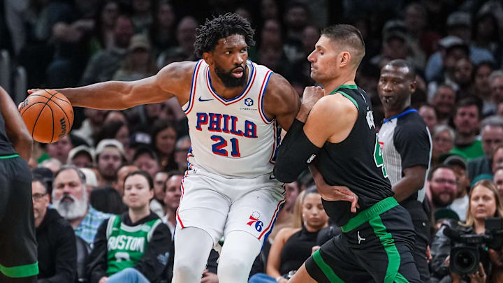Apr 28, 2026; Boston, Massachusetts, USA; Philadelphia 76ers center Joel Embiid (21) moves the ball against Boston Celtics center Nikola Vucevic (4) in the second half during game five of the first round of the 2026 NBA Playoffs at TD Garden. Mandatory Credit: David Butler II-Imagn Images