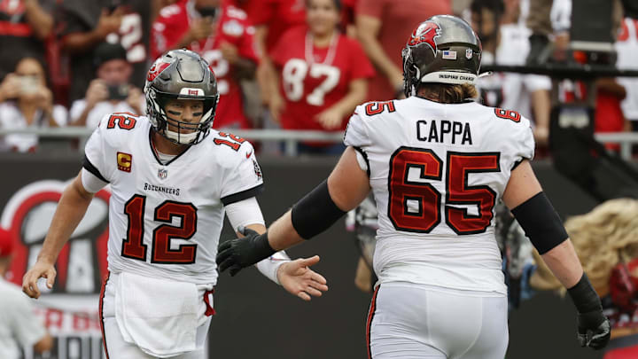 Tampa Bay Buccaneers quarterback Tom Brady and offensive guard Alex Cappa. Tampa Bay Buccaneers quarterback Tom Brady and offensive guard Alex Cappa.