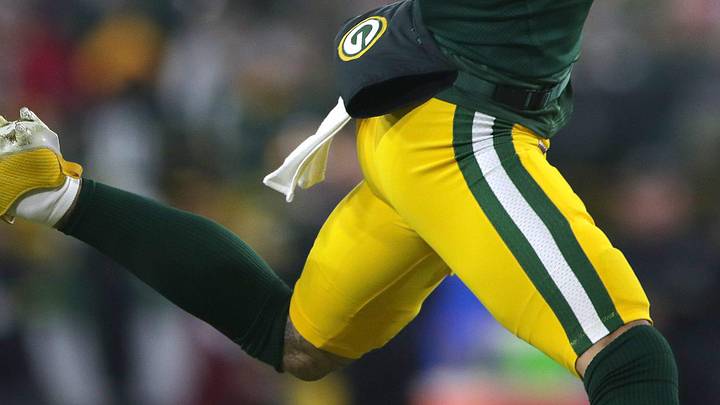 Green Bay Packers receiver Christian Watson (9) catches a touchdown pass against the Baltimore Ravens.