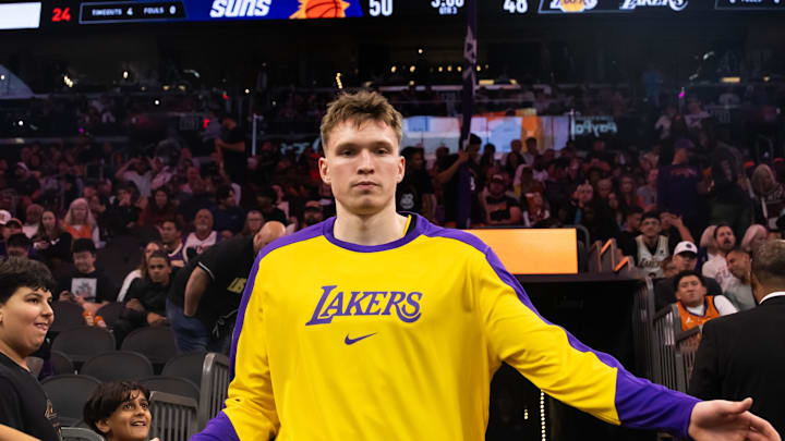 Oct 28, 2024; Phoenix, Arizona, USA; Los Angeles Lakers guard Dalton Knecht (4) against the Phoenix Suns at Footprint Center. Mandatory Credit: Mark J. Rebilas-Imagn Images