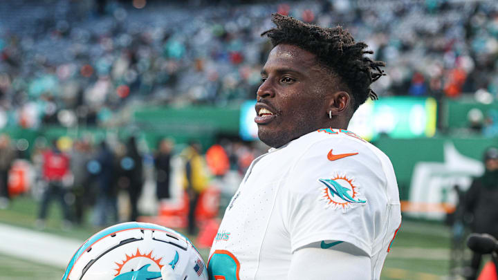 Miami Dolphins receiver Tyreek Hill stands on the field.