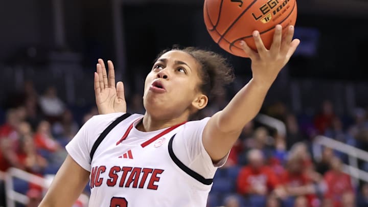 Mar 7, 2025; Greensboro, NC, USA;  NC State Wolfpack guard Zamareya Jones (3) goes to the basket during the third quarter against Georgia Tech Yellow Jackets at First Horizon Coliseum. Mandatory Credit: Cory Knowlton-Imagn Images