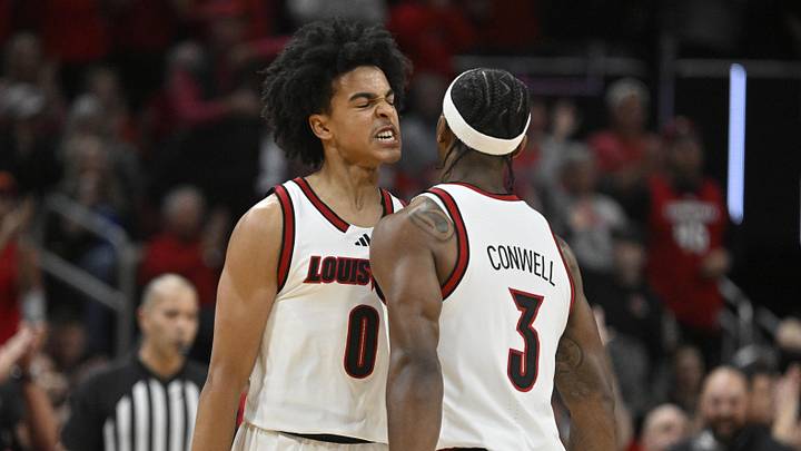 Nov 11, 2025; Louisville, Kentucky, USA; Louisville Cardinals guard Mikel Brown Jr. (0) and guard Ryan Conwell (3) celebrate during the first half against the Kentucky Wildcats at KFC Yum! Center. Mandatory Credit: Jamie Rhodes-Imagn Images Nov 11, 2025; Louisville, Kentucky, USA; Louisville Cardinals guard Mikel Brown Jr. (0) and guard Ryan Conwell (3) celebrate during the first half against the Kentucky Wildcats at KFC Yum! Center. Mandatory Credit: Jamie Rhodes-Imagn Images
