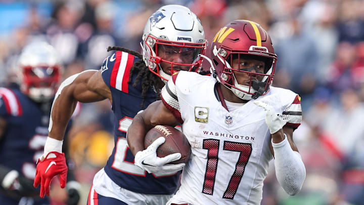 Nov 5, 2023; Foxborough, Massachusetts, USA; Washington Commanders receiver Terry McLaurin (17) runs the ball during the second half against the New England Patriots at Gillette Stadium. Mandatory Credit: Paul Rutherford-Imagn Images