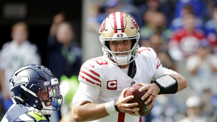 Sep 7, 2025; Seattle, Washington, USA; San Francisco 49ers quarterback Brock Purdy (13) runs the ball during the first half against the Seattle Seahawks at Lumen Field. Mandatory Credit: Joe Nicholson-Imagn Images