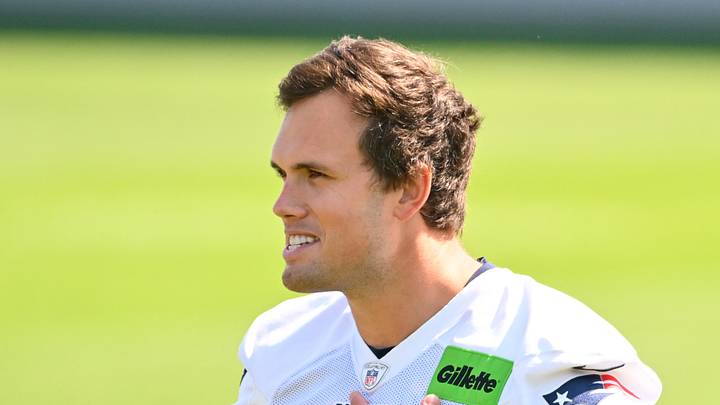 Jul 25, 2026; Foxborough, MA, USA; New England Patriots tight end Hunter Henry (85) delivers a puppy to its new family at training camp at Gillette Stadium. Mandatory Credit: Eric Canha-Imagn Images