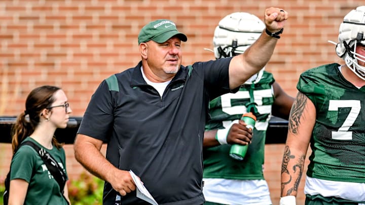 Michigan State's offensive line coach Jim Michalczik works with the team during the first day of football camp on Tuesday, July 30, 2024, in East Lansing.