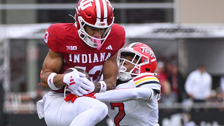 Indiana Hoosiers wide receiver Elijah Sarratt (13) catches a pass against Maryland Terrapins defensive back Braydon Lee (2) during the first half at Memorial Stadium in Bloomington, Ind.