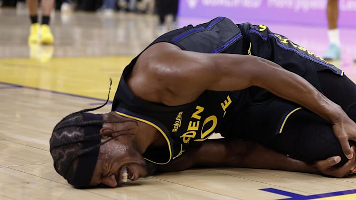 Jan 19, 2026; San Francisco, California, USA; Golden State Warriors forward Jimmy Butler III (10) holds his right knee as he goes down with an injury during the third quarter against the Miami Heat at Chase Center. Mandatory Credit: Kelley L Cox-Imagn Images