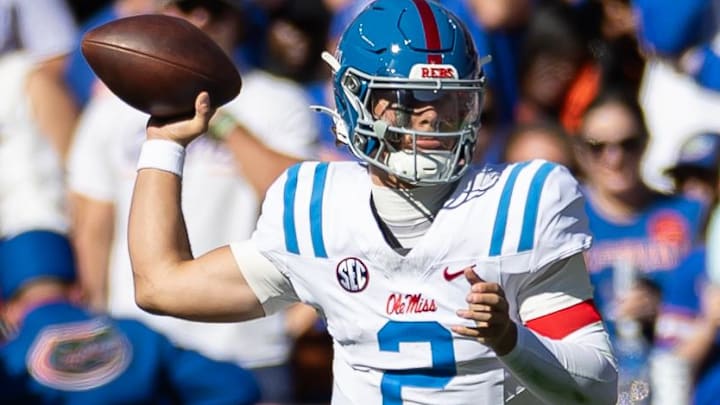Nov 23, 2024; Gainesville, Florida, USA; Mississippi Rebels quarterback Jaxson Dart (2) throws the ball against the Florida Gators during the first half at Ben Hill Griffin Stadium. Mandatory Credit: Matt Pendleton-Imagn Images