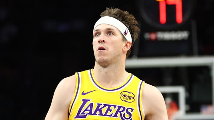 Feb 26, 2026; Phoenix, Arizona, USA; Los Angeles Lakers guard Austin Reaves (15) against the Phoenix Suns at Mortgage Matchup Center. Mandatory Credit: Mark J. Rebilas-Imagn Images