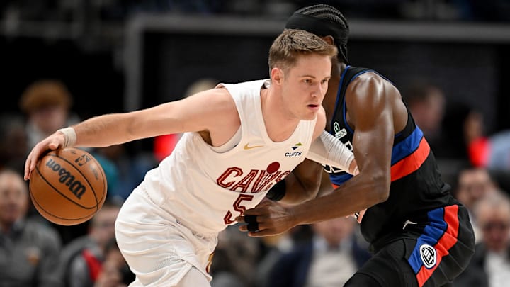 Feb 27, 2026; Detroit, Michigan, USA;  Cleveland Cavaliers guard Sam Merrill (5) tries to drive past Detroit Pistons guard Caris LeVert (8) in the first half at Little Caesars Arena. Mandatory Credit: Lon Horwedel-Imagn Images