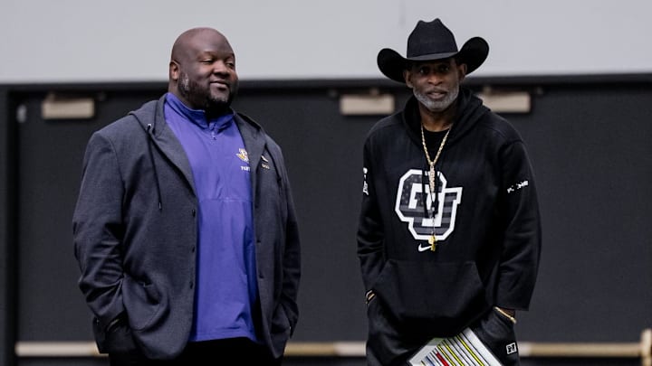 Coach Tremaine Jackson (left) visits Colorado head coach Deion Sanders (right)