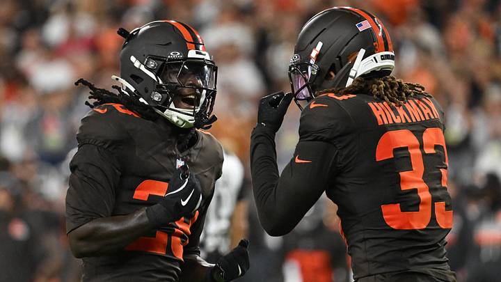 Cleveland Browns safety Emmanuel McNeil-Warren, left, reacts with Ronnie Hickman