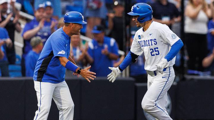 Jun 8, 2024; Lexington, KY, USA; Kentucky Wildcats infielder Ryan Nicholson (25) fives Kentucky Wildcats head coach Nick Mingione after hitting a home run during the seventh inning against the Oregon State Beavers at Kentucky Proud Park. Mandatory Credit: Jordan Prather-Imagn Images Jun 8, 2024; Lexington, KY, USA; Kentucky Wildcats infielder Ryan Nicholson (25) fives Kentucky Wildcats head coach Nick Mingione after hitting a home run during the seventh inning against the Oregon State Beavers at Kentucky Proud Park. Mandatory Credit: Jordan Prather-Imagn Images