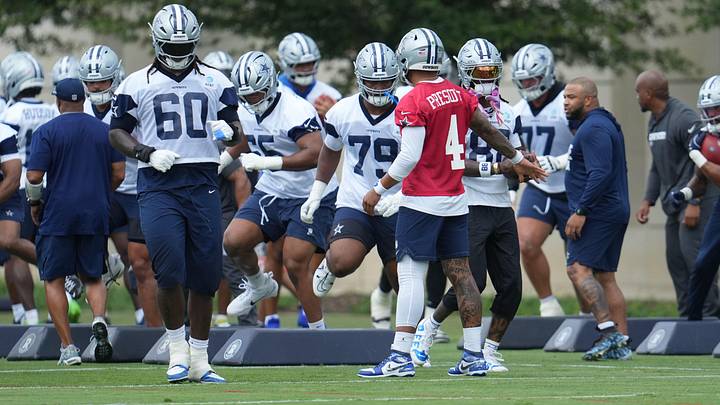 Dallas Cowboys QB Dak Prescott leads teammates through a drill during practice at the Ford Center.