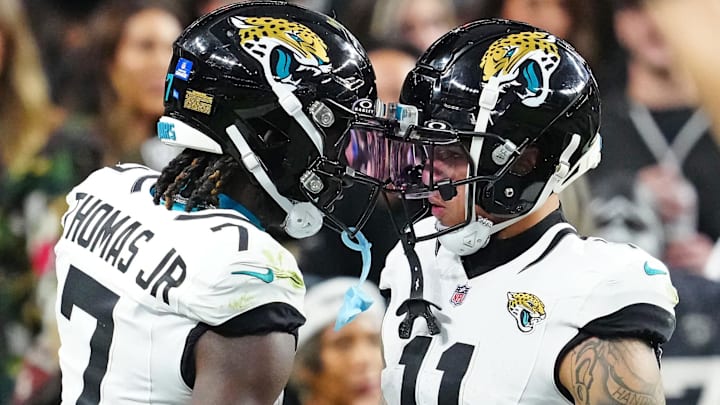 Dec 22, 2024; Paradise, Nevada, USA; Jacksonville Jaguars wide receiver Brian Thomas Jr. (7) celebrates with wide receiver Parker Washington (11) after scoring a touchdown against the Las Vegas Raiders during the third quarter at Allegiant Stadium. Mandatory Credit: Stephen R. Sylvanie-Imagn Images Dec 22, 2024; Paradise, Nevada, USA; Jacksonville Jaguars wide receiver Brian Thomas Jr. (7) celebrates with wide receiver Parker Washington (11) after scoring a touchdown against the Las Vegas Raiders during the third quarter at Allegiant Stadium. Mandatory Credit: Stephen R. Sylvanie-Imagn Images