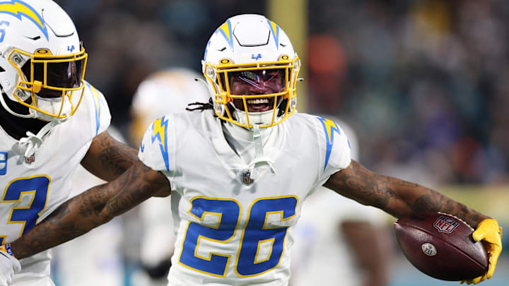 Jan 14, 2023; Jacksonville, Florida, USA; Los Angeles Chargers cornerback Asante Samuel Jr. (26) celebrates with safety Derwin James Jr. (3) after an interception during the second quarter of a wild card game against the Jacksonville Jaguars at TIAA Bank Field. Mandatory Credit: Nathan Ray Seebeck-Imagn Images Jan 14, 2023; Jacksonville, Florida, USA; Los Angeles Chargers cornerback Asante Samuel Jr. (26) celebrates with safety Derwin James Jr. (3) after an interception during the second quarter of a wild card game against the Jacksonville Jaguars at TIAA Bank Field. Mandatory Credit: Nathan Ray Seebeck-Imagn Images
