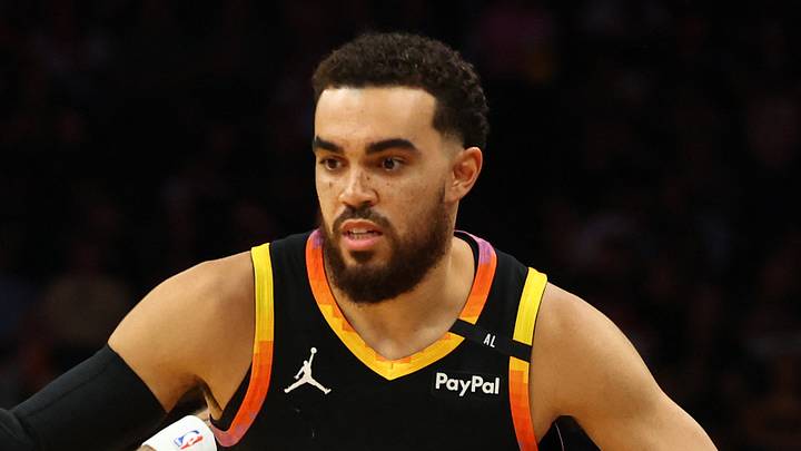 Phoenix, Arizona, USA; Phoenix Suns guard Tyus Jones (21) dribbles around Oklahoma City Thunder forward Adam Flagler (14) during the first half at Footprint Center on Apr 9, 2025. Phoenix, Arizona, USA; Phoenix Suns guard Tyus Jones (21) dribbles around Oklahoma City Thunder forward Adam Flagler (14) during the first half at Footprint Center on Apr 9, 2025.