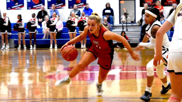George Rogers Clark junior point guard Kennedy Stamper dribbles around Sacred Heart Academy junior guard Amirah Jordan in a game won by GSR Feb. 17, 2026.