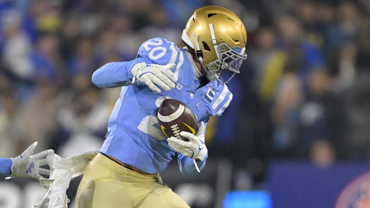 Nov 8, 2024; Pasadena, California, USA; UCLA Bruins linebacker Kain Medrano (20) strips the ball from Iowa Hawkeyes quarterback Brendan Sullivan (1) giving the Bruins possession in the first half at the Rose Bowl. Mandatory Credit: Jayne Kamin-Oncea-Imagn Images Nov 8, 2024; Pasadena, California, USA; UCLA Bruins linebacker Kain Medrano (20) strips the ball from Iowa Hawkeyes quarterback Brendan Sullivan (1) giving the Bruins possession in the first half at the Rose Bowl. Mandatory Credit: Jayne Kamin-Oncea-Imagn Images