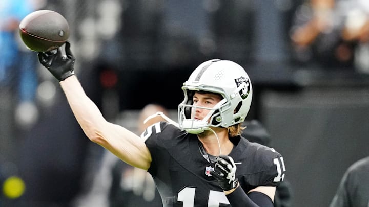 Oct 12, 2025; Paradise, Nevada, USA; Las Vegas Raiders quarterback Kenny Pickett (15) warms up before the game against the Tennessee Titans at Allegiant Stadium. Mandatory Credit: Stephen R. Sylvanie-Imagn Images
