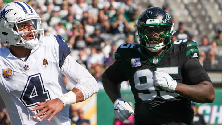 Oct 5, 2025; East Rutherford, New Jersey, USA; Dallas Cowboys quarterback Dak Prescott (4) looks to pass downfield as New York Jets defensive tackle Quinnen Williams (95) defends during the first half at MetLife Stadium. Mandatory Credit: Robert Deutsch-Imagn Images Oct 5, 2025; East Rutherford, New Jersey, USA; Dallas Cowboys quarterback Dak Prescott (4) looks to pass downfield as New York Jets defensive tackle Quinnen Williams (95) defends during the first half at MetLife Stadium. Mandatory Credit: Robert Deutsch-Imagn Images