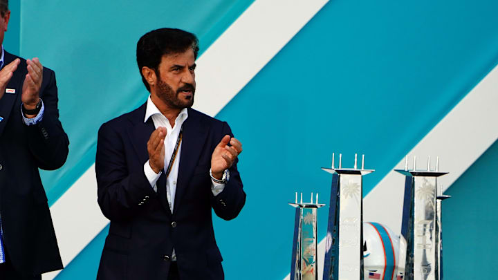 May 8, 2022; Miami Gardens, Florida, USA; Dan Marino and FIA president Mohammed Ben Sulayem applaud during the award ceremony following the Miami Grand Prix at Miami International Autodrome. Mandatory Credit: John David Mercer-Imagn Images
