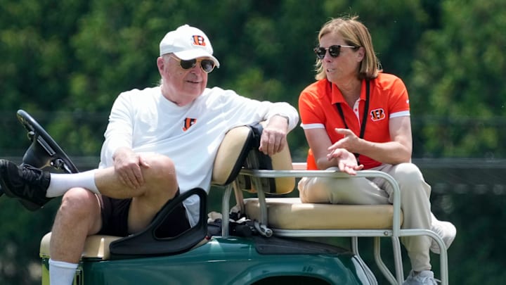 Cincinnati Bengals executives Mike Brown and his daughter Katie Blackburn talk on the sideline during a session of organized team activities on the Bengals practice field at Paycor Stadium in downtown Cincinnati on Tuesday, June 3, 2025.