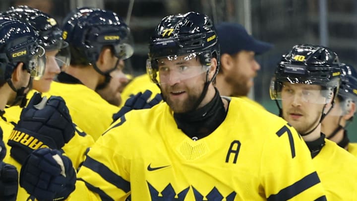 Feb 11, 2026; Milan, Italy;  Victor Hedman of Sweden celebrates scoring their fifth goal with teammates in men's ice hockey group B play during the Milano Cortina 2026 Olympic Winter Games at Milano Santagiulia Ice Hockey Arena. Mandatory Credit: Geoff Burke-Imagn Images