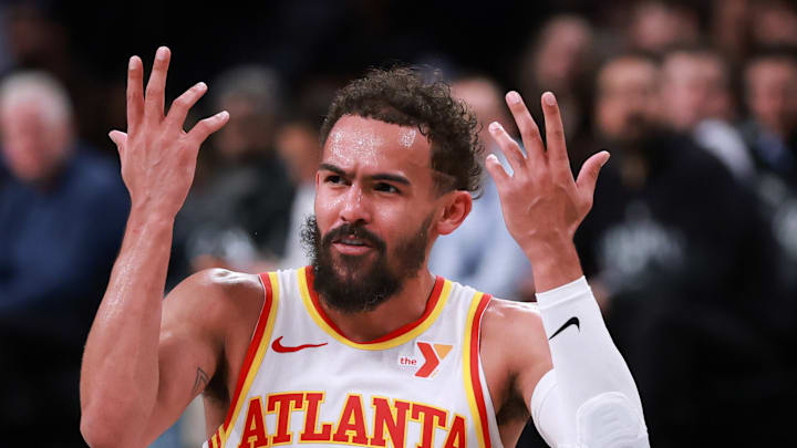 Trae Young throws his hands up in disbelief Trae Young throws his hands up in disbelief