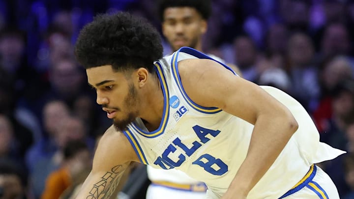 Mar 20, 2026; Philadelphia, PA, USA; UCLA Bruins guard Eric Freeny (8) dribbles the ball against the UCF Knights in the second half during a first round game of the men's 2026 NCAA Tournament at Xfinity Mobile Arena. Mandatory Credit: Bill Streicher-Imagn Images